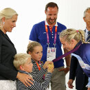 11 August: The Crown Prince and Crown Princess watch cycling, javelin and handball. Prince Sverre Magnus feels the gold medal of Ida Alstad after the Norwegian women&#146;s handball team's victory against Montenegro in the finals (Photo: Håkon Mosvold Larsen, NTB scanpix)